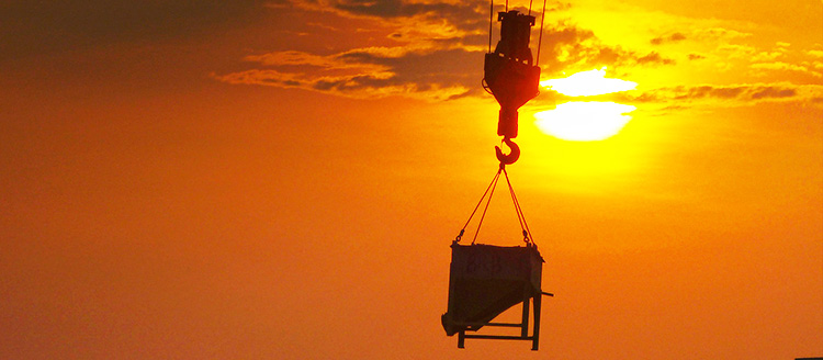 construction crane lifting cargo
