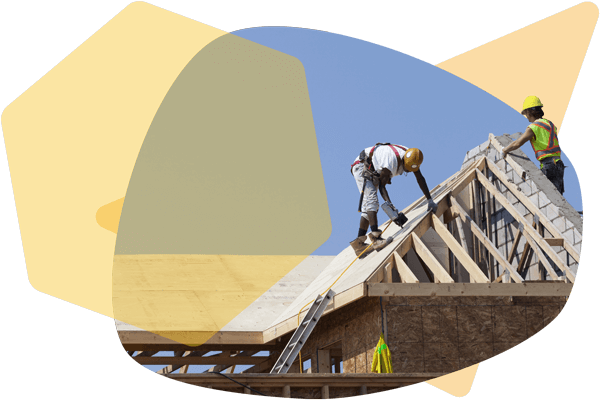 Contractors on the roof of a house working