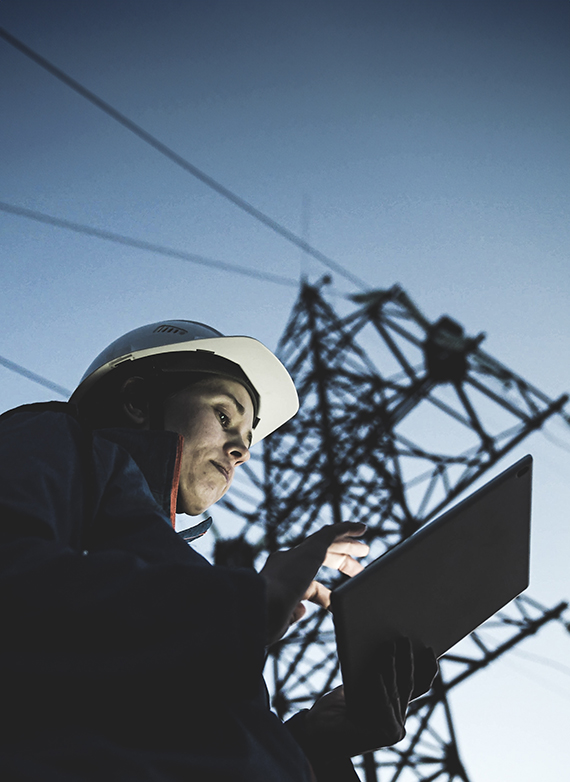 virginia-contractor-reviewing-a-job-costing-report-on-a-tablet-at-a-jobsite